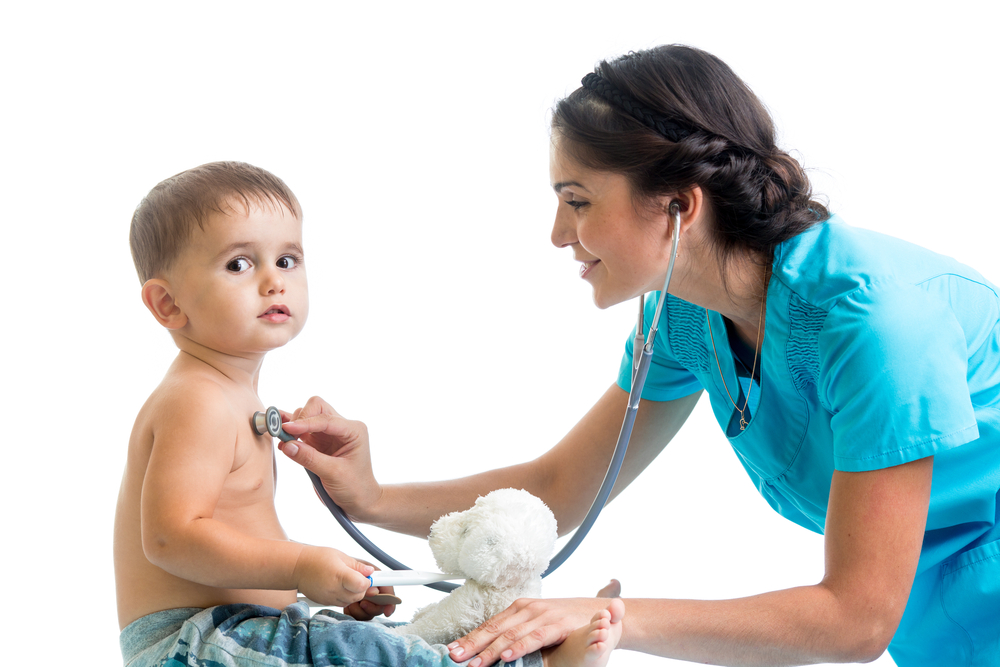 Nurse who has PALS training in Tempe, AZ, checking child's heartbeat