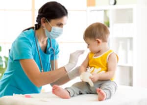 Pediatric nurse with a baby after completing ENPC certification in Mesa, AZ