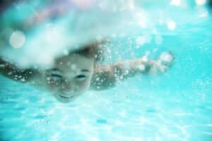 Child swimming in pool in Tempe, AZ