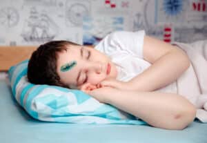 Child laying in hospital bed after pediatric emergency in Tempe, AZ