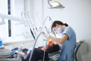 BLS trained dentist working on a patient's teeth in Mesa, AZ