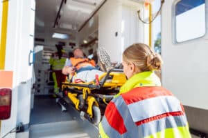Paramedics loading a patient into the ambulance after training in Tempe, AZ