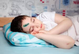 Child resting with head injury after ENPC care in Tempe, AZ
